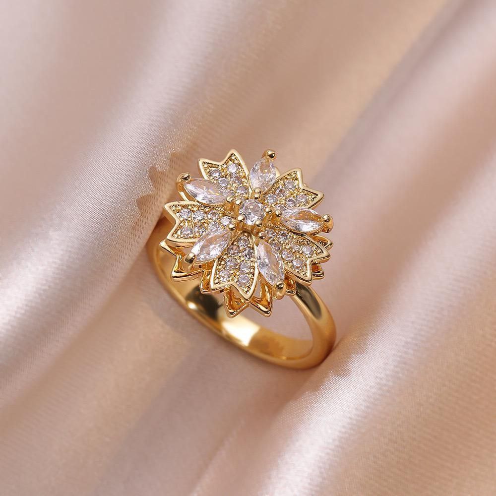 Anillo ajustable flor giratoria