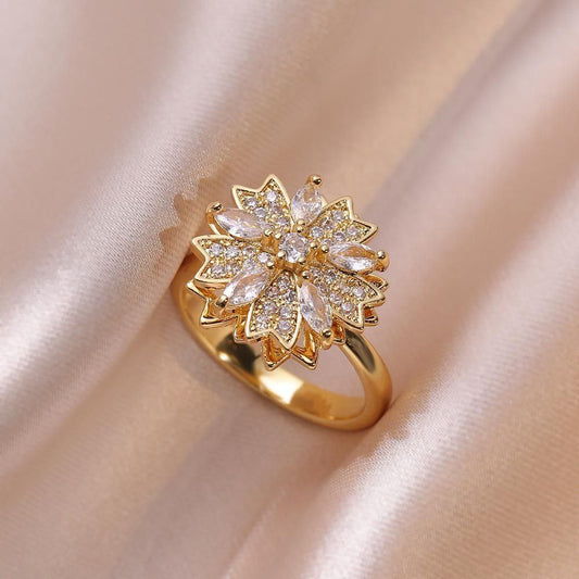 Anillo ajustable flor giratoria
