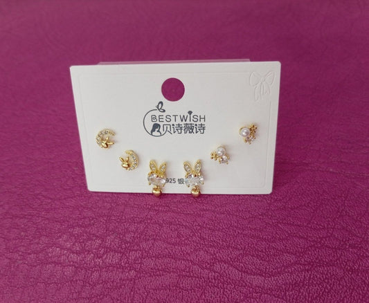 Set de tres pares  de aretes de conejitos con lunas