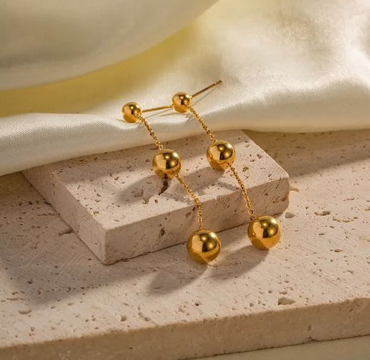 Aretes largos bolitas